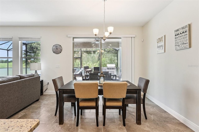 1833 Benoit Ter, Davenport, FL 33837 - dining space featuring a chandelier and baseboards