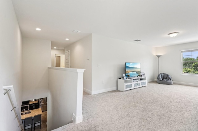 1833 Benoit Ter, Davenport, FL 33837 - living area featuring an upstairs landing, carpet floors, and recessed lighting