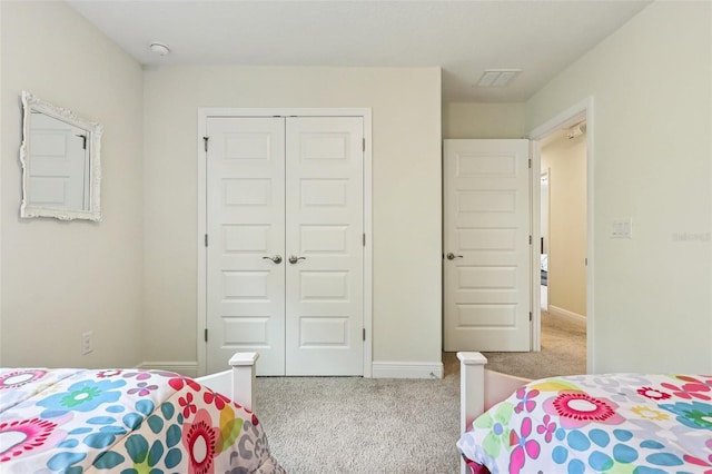 1833 Benoit Ter, Davenport, FL 33837 - carpeted bedroom featuring a closet and baseboards