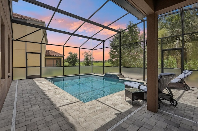 1833 Benoit Ter, Davenport, FL 33837 - pool at dusk with an outdoor pool, a patio area, and a lanai