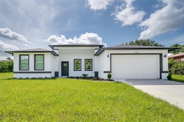 1157 W Hancock Dr, Deltona, FL 32725 - prairie-style home with stucco siding, a garage, driveway, and a front lawn