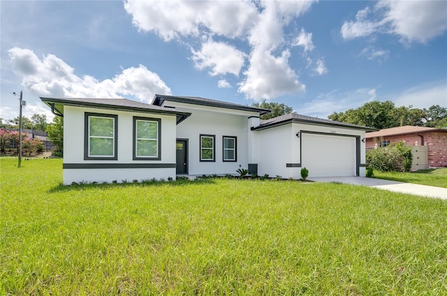1157 W Hancock Dr, Deltona, FL 32725 - prairie-style house with stucco siding, concrete driveway, an attached garage, and a front yard