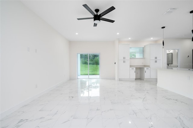 1157 W Hancock Dr, Deltona, FL 32725 - unfurnished living room with a ceiling fan, plenty of natural light, recessed lighting, and light marble finish floors