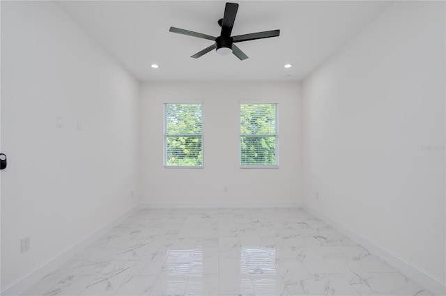 1157 W Hancock Dr, Deltona, FL 32725 - spare room featuring light marble finish flooring, recessed lighting, and ceiling fan