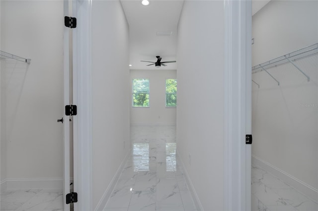 1157 W Hancock Dr, Deltona, FL 32725 - hallway with marble look tiles and recessed lighting