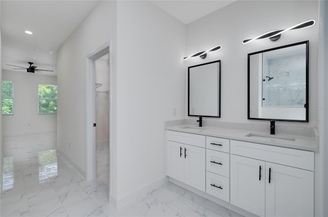 1157 W Hancock Dr, Deltona, FL 32725 - bathroom featuring marble look tiles, double vanity, ceiling fan, a walk in closet, and a marble finish shower