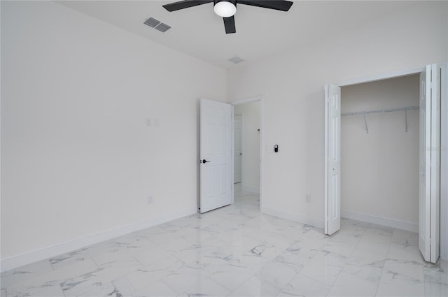 1157 W Hancock Dr, Deltona, FL 32725 - unfurnished bedroom with light marble finish flooring, a closet, and a ceiling fan