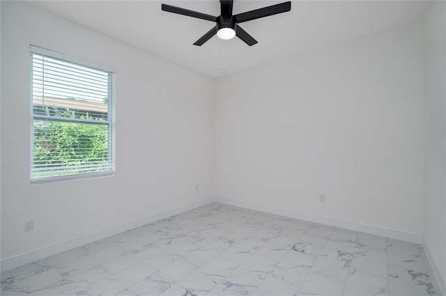 1157 W Hancock Dr, Deltona, FL 32725 - spare room featuring light marble finish floors and a ceiling fan