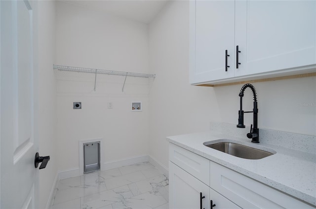 1157 W Hancock Dr, Deltona, FL 32725 - washroom with cabinet space, electric dryer hookup, light marble finish floors, and hookup for a washing machine