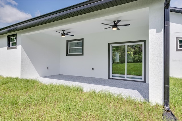 1157 W Hancock Dr, Deltona, FL 32725 - rear view of property featuring a ceiling fan and stucco siding