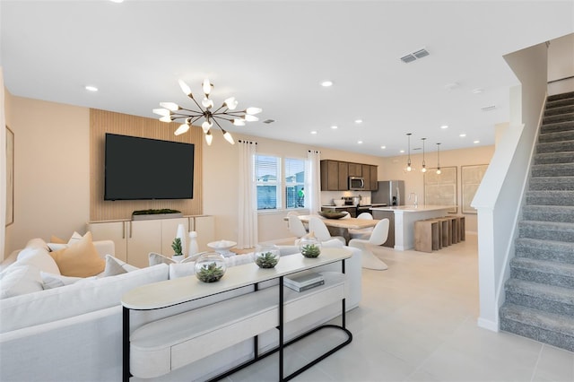 2302 Southbury Dr, Kissimmee, FL 34744 - living room with stairway, a chandelier, and recessed lighting