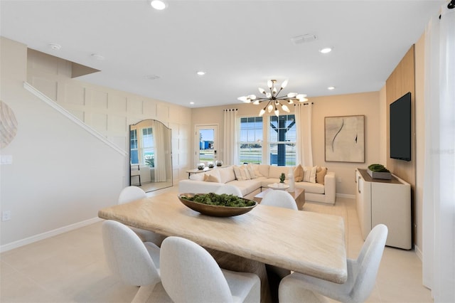 2302 Southbury Dr, Kissimmee, FL 34744 - dining room featuring a chandelier, recessed lighting, and light tile patterned floors