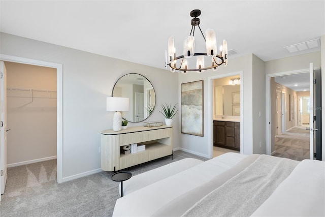 2302 Southbury Dr, Kissimmee, FL 34744 - bedroom featuring a chandelier, light colored carpet, a spacious closet, and ensuite bathroom
