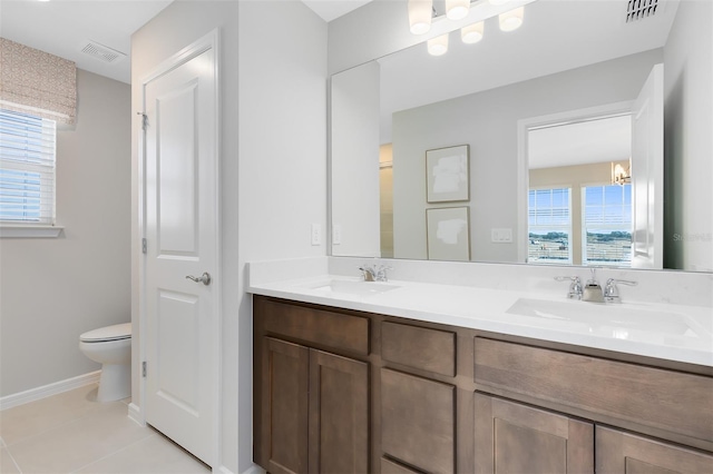 2302 Southbury Dr, Kissimmee, FL 34744 - full bathroom featuring double vanity, plenty of natural light, tile patterned flooring, and a chandelier