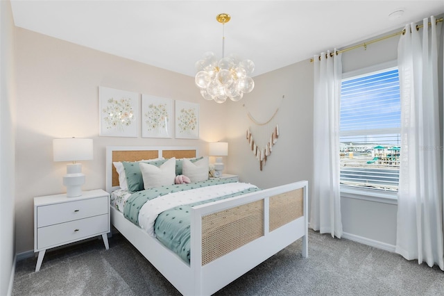 2302 Southbury Dr, Kissimmee, FL 34744 - carpeted bedroom featuring a chandelier and a water view