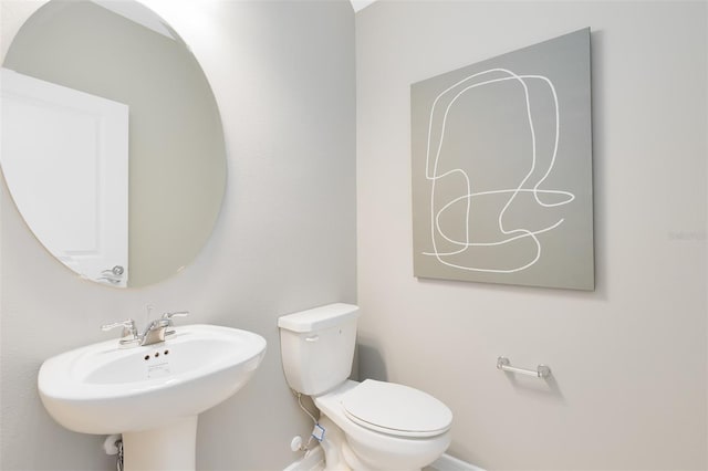 2302 Southbury Dr, Kissimmee, FL 34744 - half bath with toilet and a sink