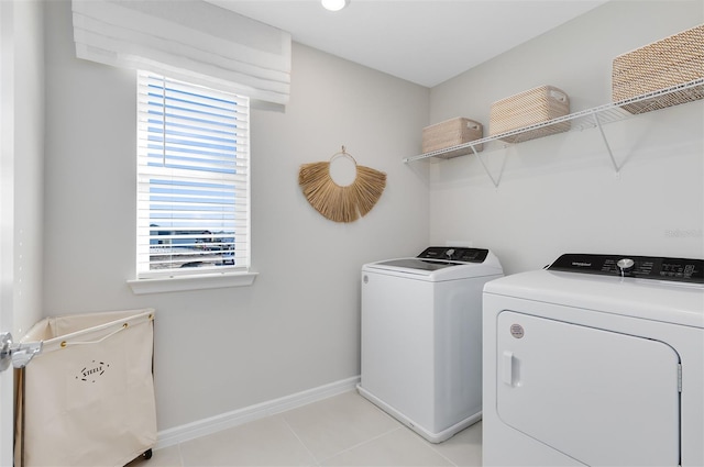 2302 Southbury Dr, Kissimmee, FL 34744 - laundry area with independent washer and dryer and light tile patterned floors