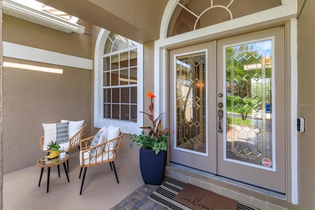 4216 Fawn Meadows Cir, Clermont, FL 34711 - view of exterior entry with french doors and stucco siding