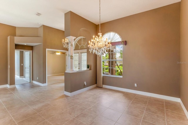 4216 Fawn Meadows Cir, Clermont, FL 34711 - empty room featuring a chandelier, light tile patterned flooring, and a ceiling fan