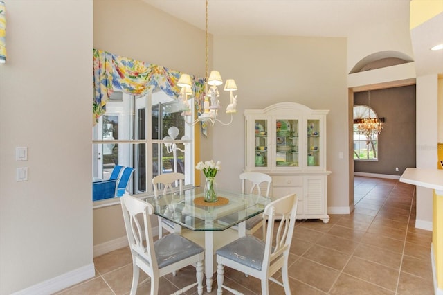 4216 Fawn Meadows Cir, Clermont, FL 34711 - tiled dining area with a chandelier and baseboards
