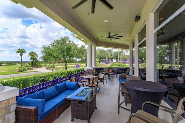 4216 Fawn Meadows Cir, Clermont, FL 34711 - view of patio with a ceiling fan, an outdoor living space with a fire pit, and outdoor dining area