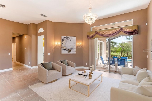 4216 Fawn Meadows Cir, Clermont, FL 34711 - tiled living room featuring a chandelier and baseboards