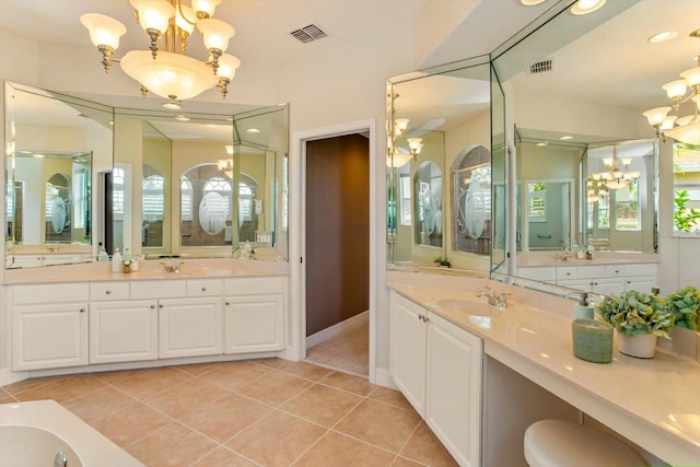 4216 Fawn Meadows Cir, Clermont, FL 34711 - full bath with a chandelier, two vanities, tile patterned floors, and healthy amount of natural light