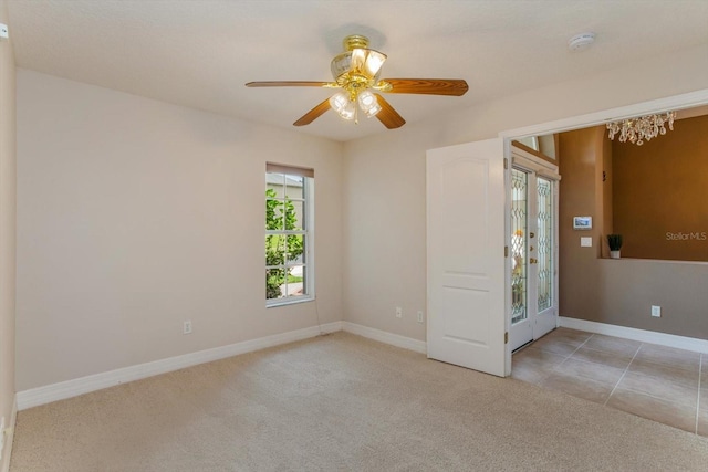 4216 Fawn Meadows Cir, Clermont, FL 34711 - spare room with a smoke detector, carpet flooring, a ceiling fan, and a chandelier