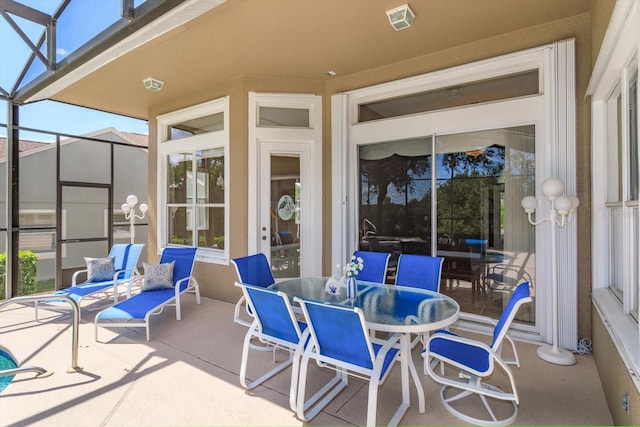 4216 Fawn Meadows Cir, Clermont, FL 34711 - view of patio / terrace featuring a lanai and outdoor dining space