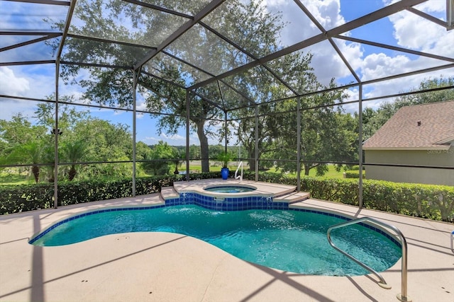 4216 Fawn Meadows Cir, Clermont, FL 34711 - view of swimming pool featuring a patio area, a lanai, a pool with connected hot tub, and view of wooded area