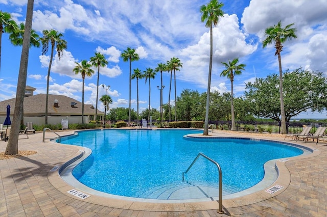 4216 Fawn Meadows Cir, Clermont, FL 34711 - community pool featuring a patio