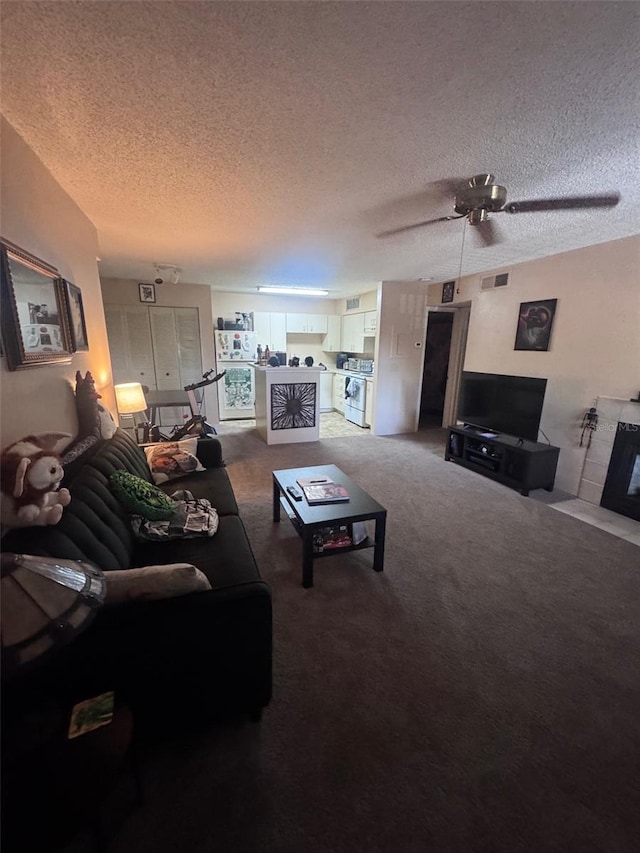 320 Forestway Cir Unit 203, Altamonte Springs, FL 32701 - living area with a textured ceiling, carpet flooring, and ceiling fan