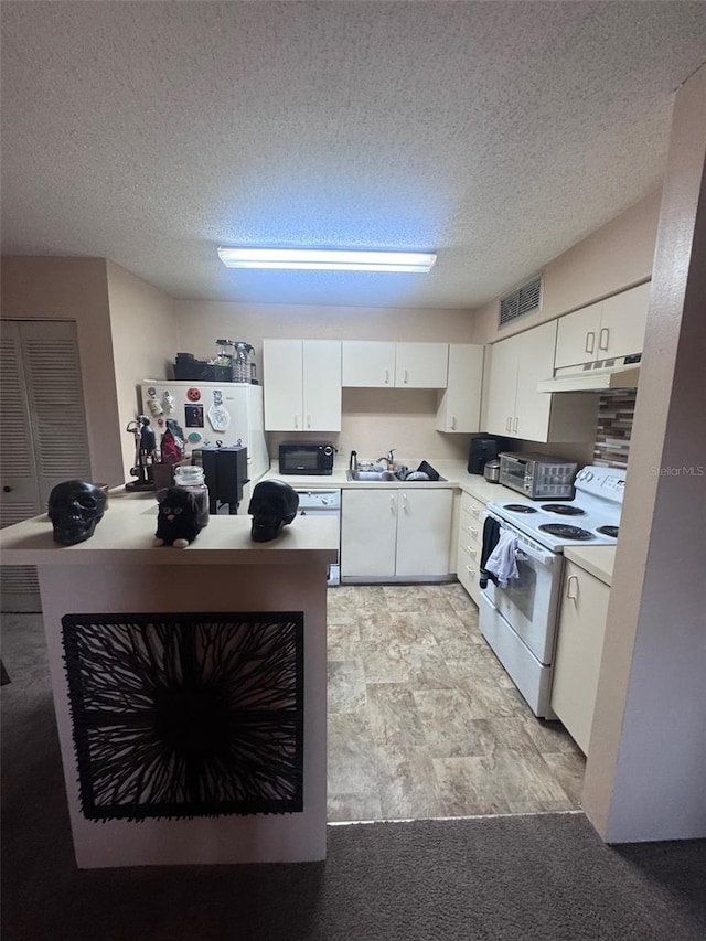 320 Forestway Cir Unit 203, Altamonte Springs, FL 32701 - kitchen featuring white appliances, white cabinetry, under cabinet range hood, light countertops, and a textured ceiling