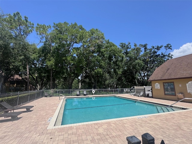 320 Forestway Cir Unit 203, Altamonte Springs, FL 32701 - community pool featuring a patio and view of scattered trees