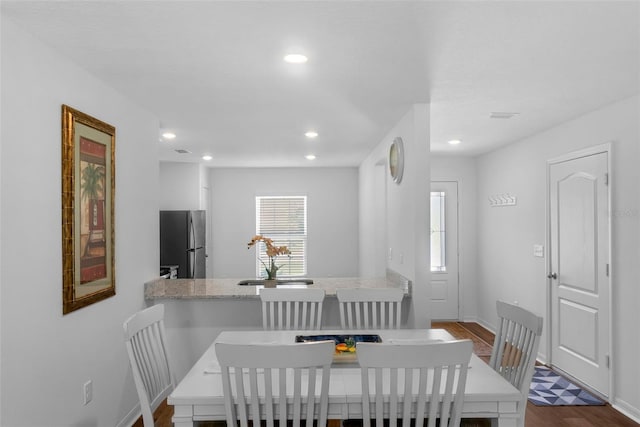 69 Pin Oak Dr, Palm Coast, FL 32164 - dining space with dark wood finished floors and recessed lighting
