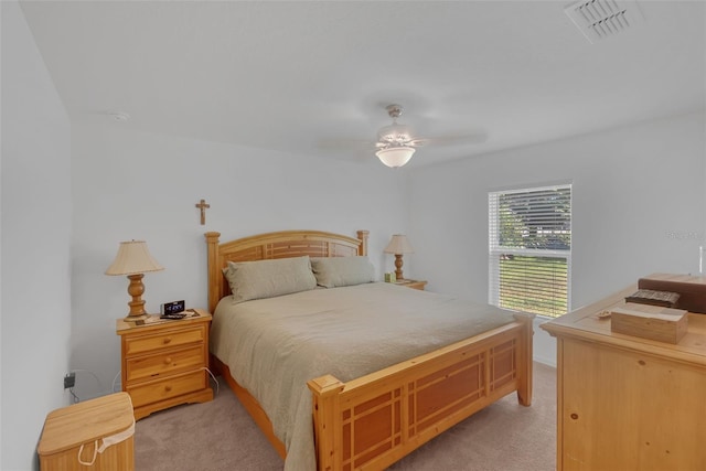 69 Pin Oak Dr, Palm Coast, FL 32164 - bedroom with light colored carpet and a ceiling fan