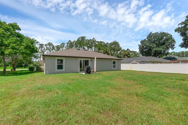 69 Pin Oak Dr, Palm Coast, FL 32164 - back of house with stucco siding