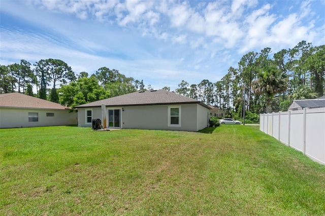 69 Pin Oak Dr, Palm Coast, FL 32164 - back of property featuring stucco siding
