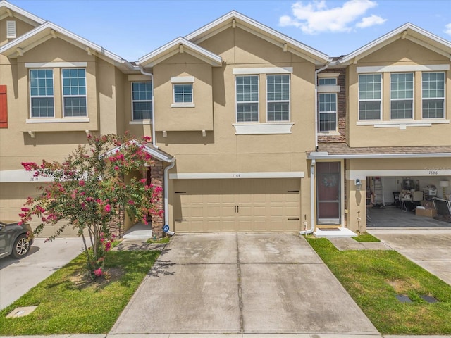 1608 Mohegan Blvd, Kissimmee, FL 34744 - traditional-style house with stucco siding, concrete driveway, and a garage