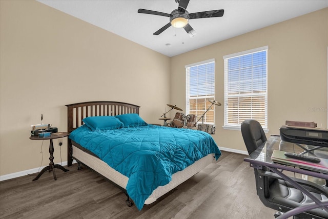 1608 Mohegan Blvd, Kissimmee, FL 34744 - bedroom with wood finished floors, a ceiling fan, and a desk