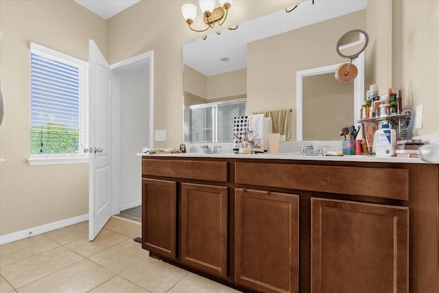1608 Mohegan Blvd, Kissimmee, FL 34744 - full bath featuring a stall shower, double vanity, tile patterned flooring, and a chandelier