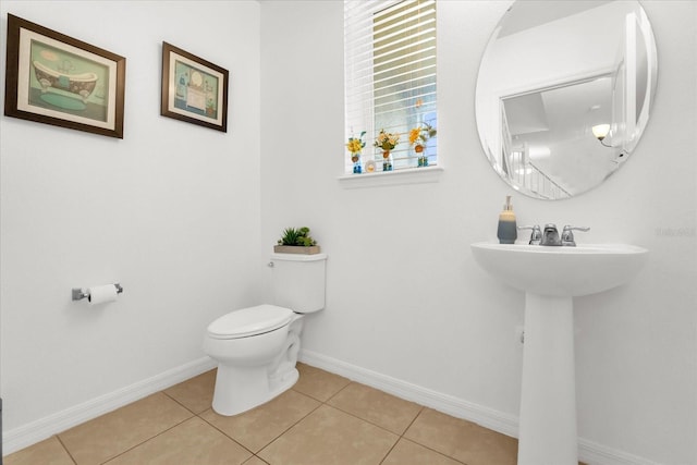 1608 Mohegan Blvd, Kissimmee, FL 34744 - bathroom featuring toilet and tile patterned flooring