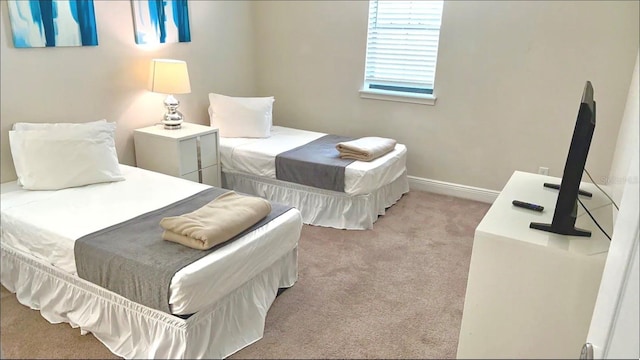 197 Macaulays Cv, Haines City, FL 33844 - bedroom with light carpet and baseboards