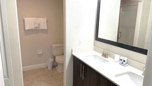 197 Macaulays Cv, Haines City, FL 33844 - bathroom with double vanity, a stall shower, and tile patterned flooring