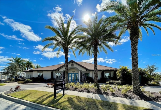 197 Macaulays Cv, Haines City, FL 33844 - view of front of house featuring stucco siding and french doors