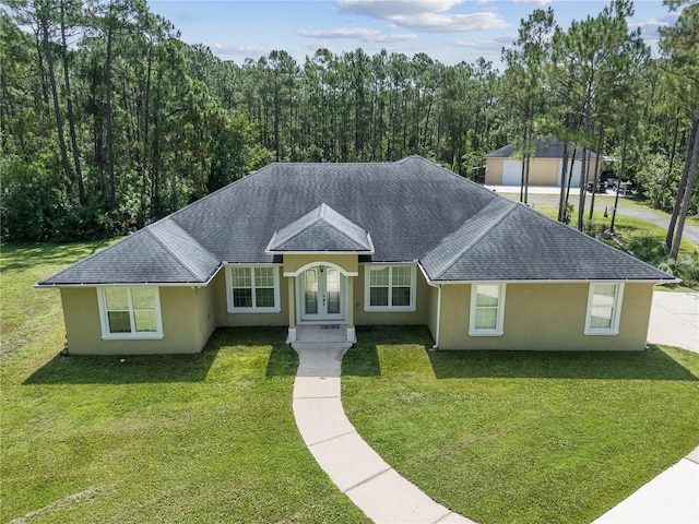 859 Leather Fern Ln, Mims, FL 32754 - ranch-style house featuring french doors, stucco siding, a shingled roof, and a front yard
