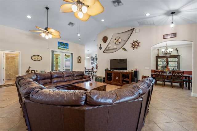 859 Leather Fern Ln, Mims, FL 32754 - living room with a ceiling fan, light tile patterned floors, a chandelier, arched walkways, and high vaulted ceiling
