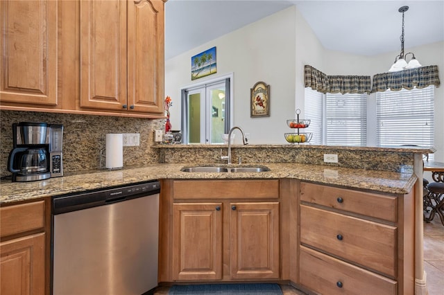859 Leather Fern Ln, Mims, FL 32754 - kitchen featuring dishwasher, a peninsula, light stone counters, decorative backsplash, and pendant lighting