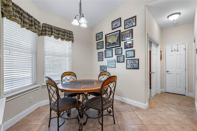859 Leather Fern Ln, Mims, FL 32754 - dining area featuring light tile patterned floors and a chandelier