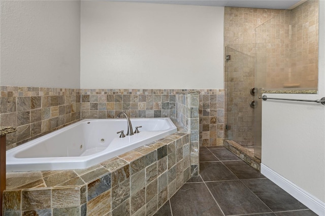 859 Leather Fern Ln, Mims, FL 32754 - full bathroom with a jetted tub, a tile shower, and tile patterned flooring